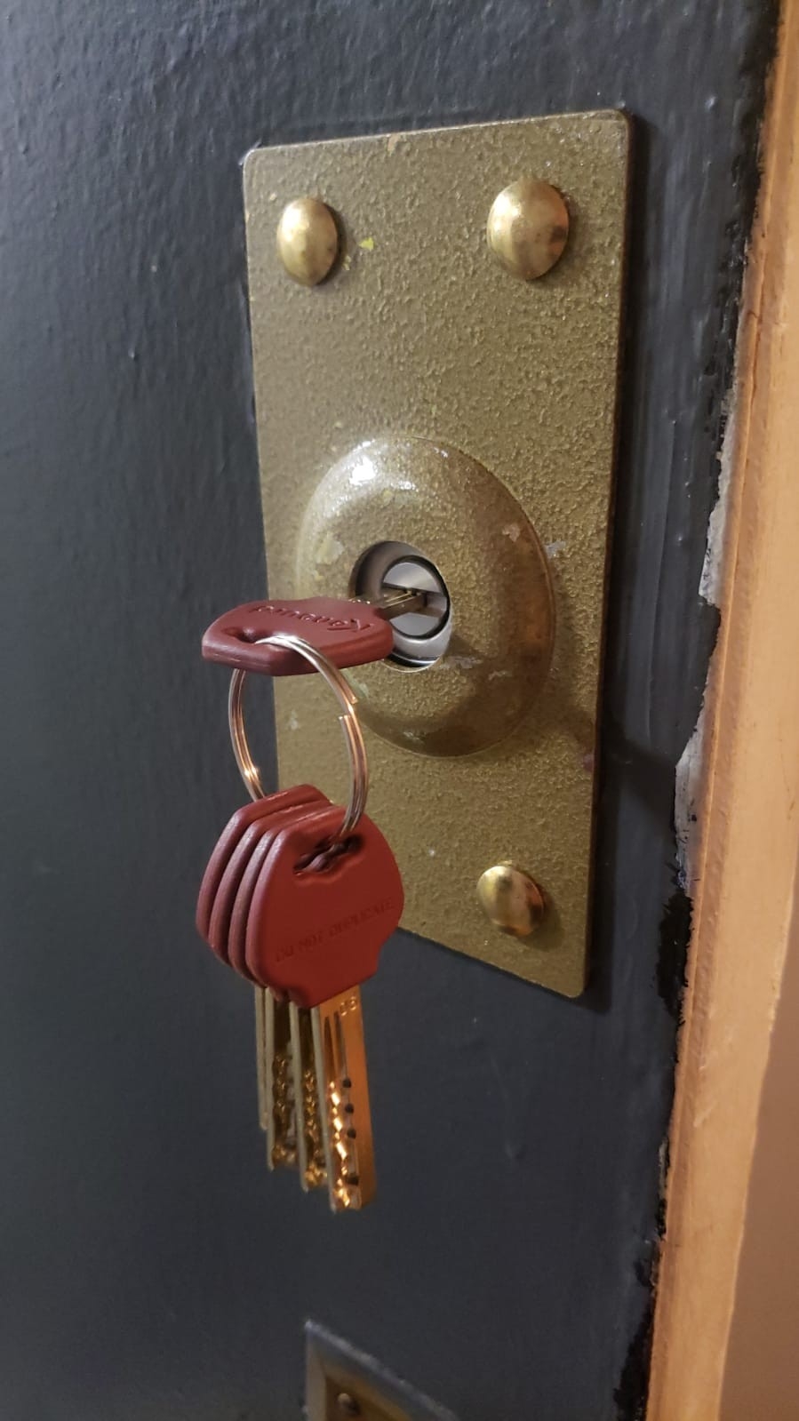 Locksmith installing smart locks on a front door