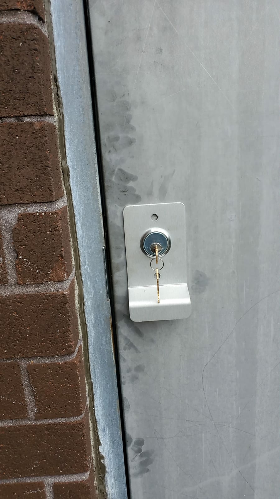 Locksmith installing a high-security lock