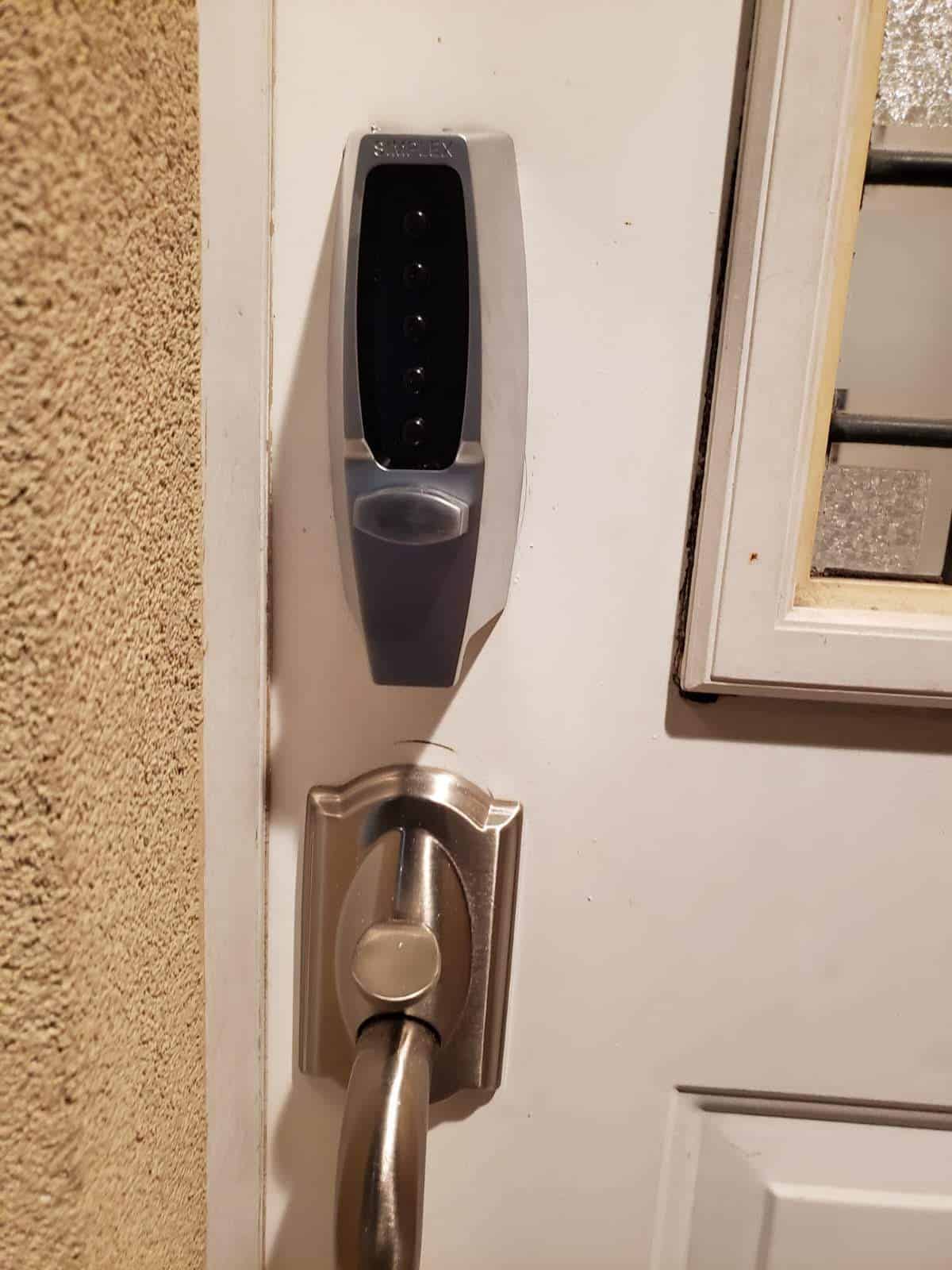 Electronic keypad smart lock installed on a residential entry door